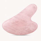 Gua Sha en quartz rose, outil de beauté pour le soin de la peau et l'énergie spirituelle.